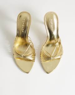 Model wearing Simba strappy mule high sandal in gold