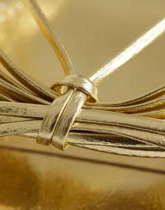 Model wearing Simba strappy mule high sandal in gold