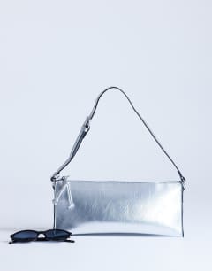Model wearing Simone shoulder bag in silver