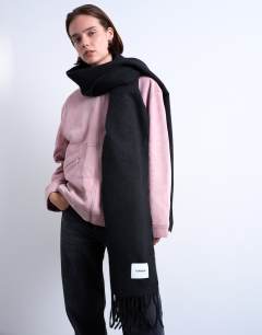 Model wearing Simone supersoft blanket scarf in black