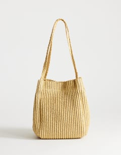 Model wearing Singer weave shoulder bag in natural
