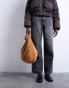 Model wearing Siobhan real suede leather shoulder bag in tan