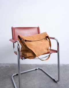 Model wearing Siobhan real suede leather shoulder bag in tan