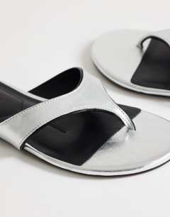 Model wearing Sisi toe thong flat sandal in silver