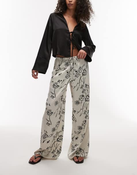 Topshop sketched floral satin drawcord trousers in black