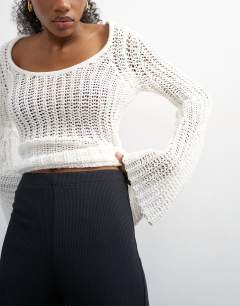 Model wearing Skinny rib flared capri trouser in black