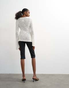 Model wearing Skinny rib flared capri trouser in black