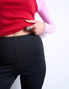 Model wearing Skinny rib flared trouser in black