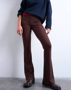 Model wearing Skinny rib flared trouser in chocolate brown