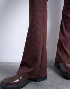 Model wearing Skinny rib flared trouser in chocolate brown