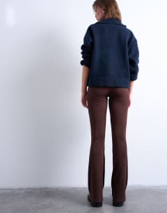 Model wearing Skinny rib flared trouser in chocolate brown