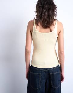 Model wearing Skinny strap scoop rib vest in buttermilk
