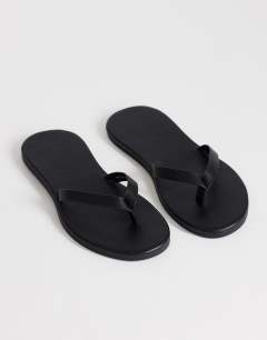 Model wearing Sky real leather toe thong sandal in black