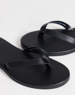 Model wearing Sky real leather toe thong sandal in black