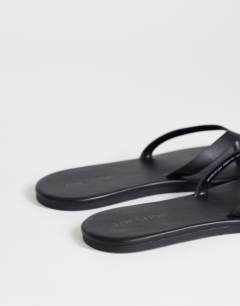 Model wearing Sky real leather toe thong sandal in black