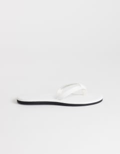 Model wearing Sky real leather toe thong sandal in white