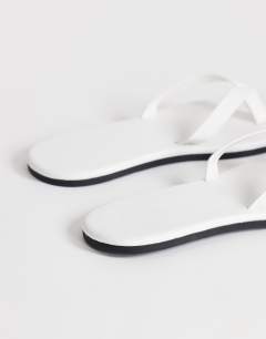 Model wearing Sky real leather toe thong sandal in white