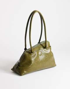 Model wearing Skyler large angular shoulder bag in green
