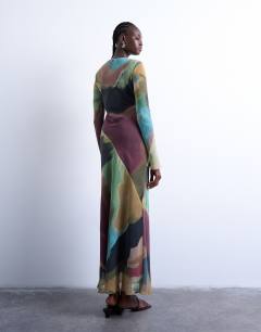 Model wearing Slash neck chiffon maxi dress in abstract print