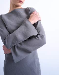 Model wearing Slash neck cupro maxi dress in grey