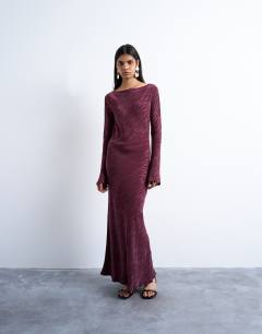 Model wearing Slash neck midi dress in burgundy premium cupro jacquard