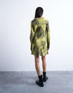 Model wearing Slash neck mini dress in blurry green print