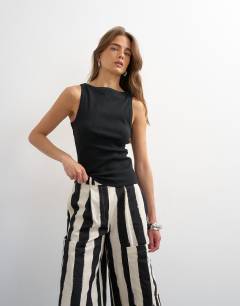 Model wearing Slash neck racer vest in black