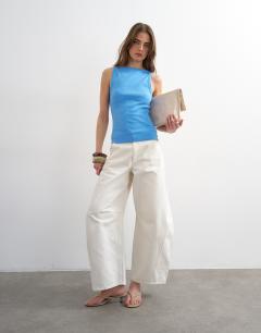 Model wearing Slash neck racer vest in blue