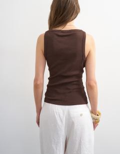 Model wearing Slash neck racer vest in dark chocolate