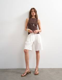 Model wearing Slash neck racer vest in dark chocolate