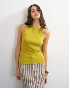 Model wearing Slash neck racer vest in green