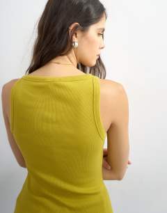 Model wearing Slash neck racer vest in green