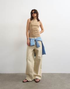 Model wearing Slash neck racer vest in stone