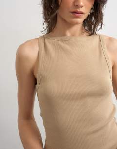 Model wearing Slash neck racer vest in stone