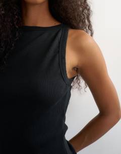 Model wearing Slash neck racer vest in washed black