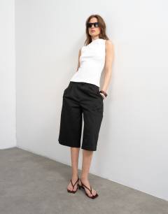 Model wearing Slash neck racer vest in white