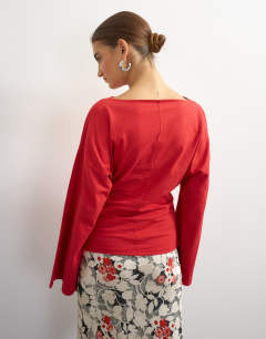Model wearing Slash neck tie front top in red