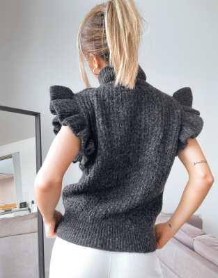 sleeveless cable knit sweater
