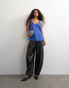 Model wearing Sleeveless organza scoop vest in cobalt blue