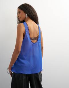 Model wearing Sleeveless organza scoop vest in cobalt blue