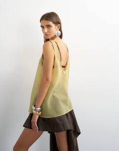 Model wearing Sleeveless organza scoop vest in muted lime