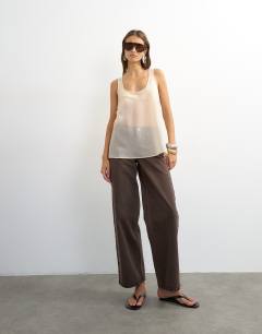 Model wearing Sleeveless organza scoop vest in oyster