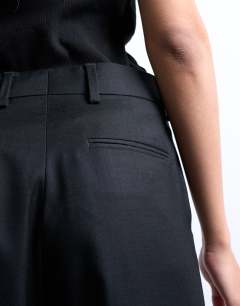 Model wearing Slim straight leg mid rise suit trouser co ord in black