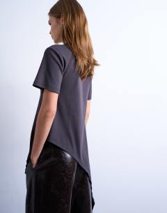 Model wearing Slinky asymmetric short sleeve tunic top in charcoal grey