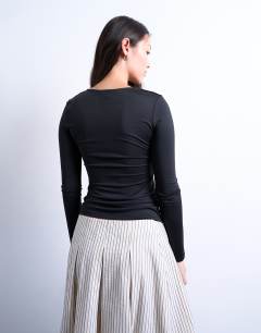 Model wearing Slinky crew neck long sleeve top in black