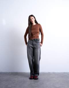 Model wearing Slinky crew neck long sleeve top in brown
