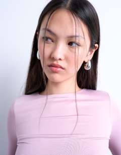 Model wearing Slinky crew neck long sleeve top in pink