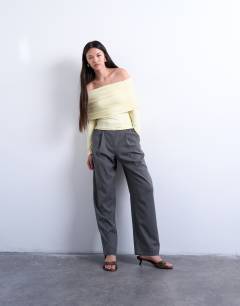 Model wearing Slinky deep fold bardot long sleeve top in buttermilk