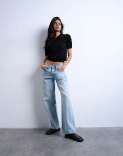 Model wearing Slinky knitted v neck top in black