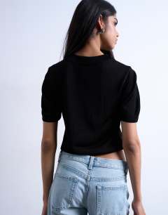 Model wearing Slinky knitted v neck top in black